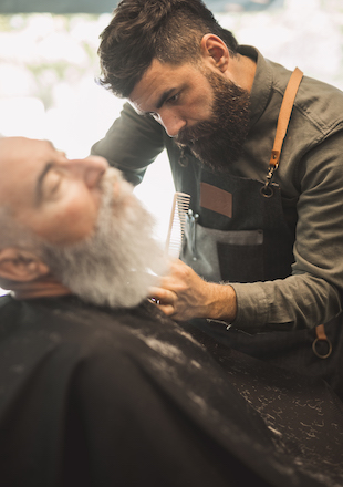adult hairdresser shaving customers beard hair salon