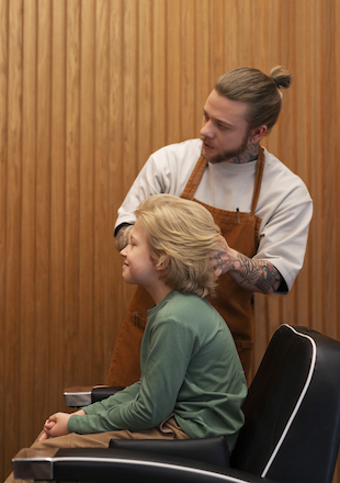 child getting haircut salon